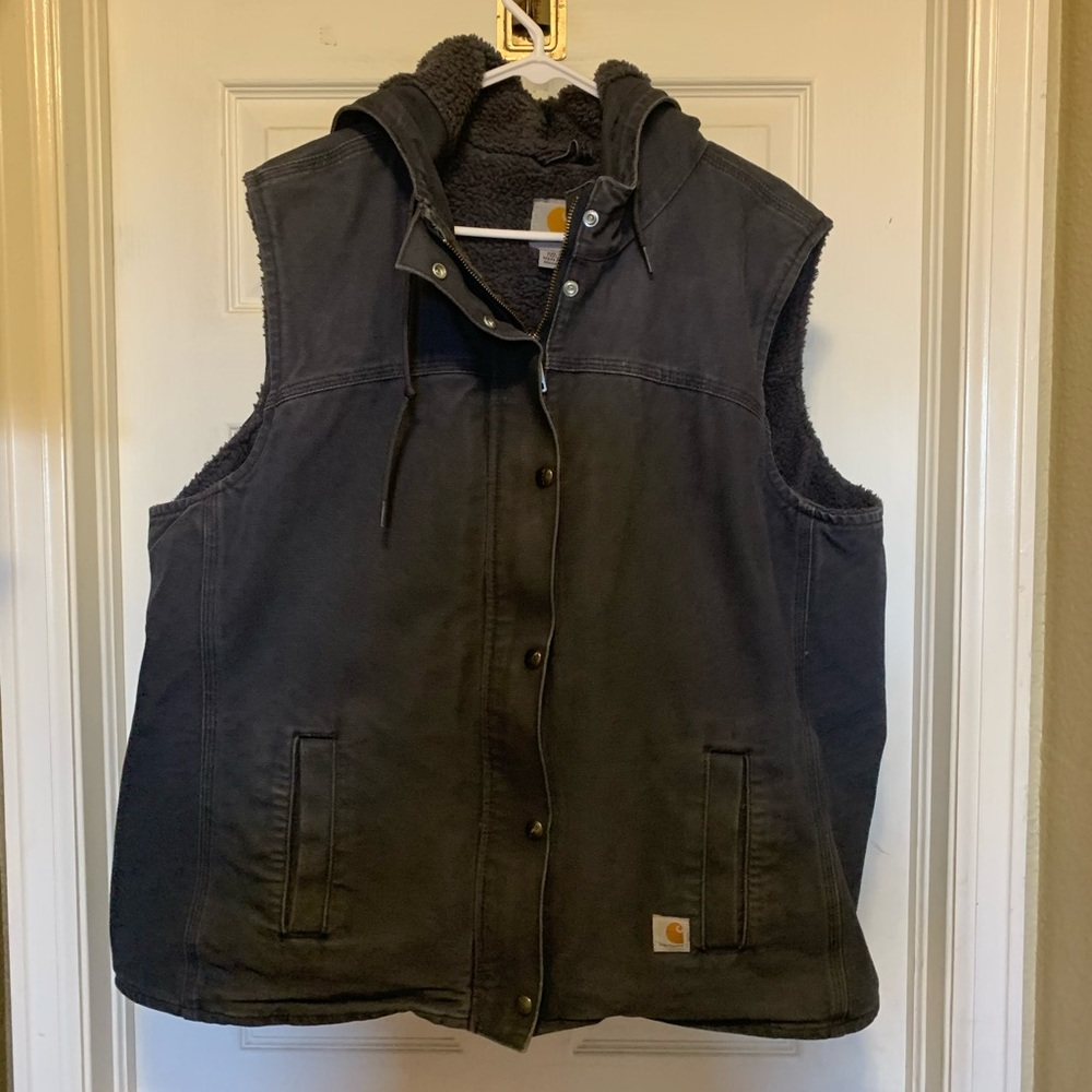 Navy blue carhartt vest, with attached hood.